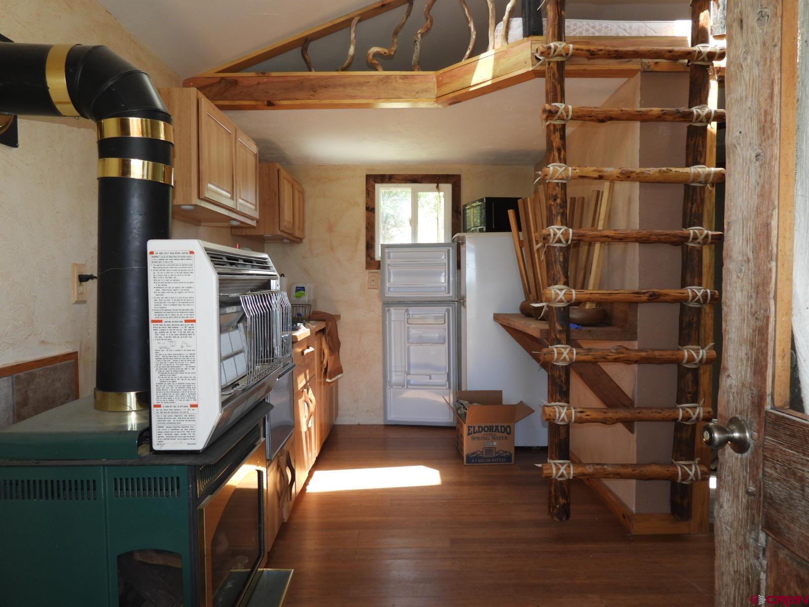 21764 R Road Cedaredge, CO 81413 - Photo 13 of 27 a view of a room with gym equipment