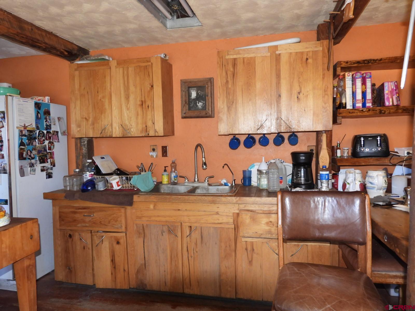 21764 R Road Cedaredge, CO 81413 - Photo 3 of 27 a kitchen with stainless steel appliances granite countertop a stove and cabinets