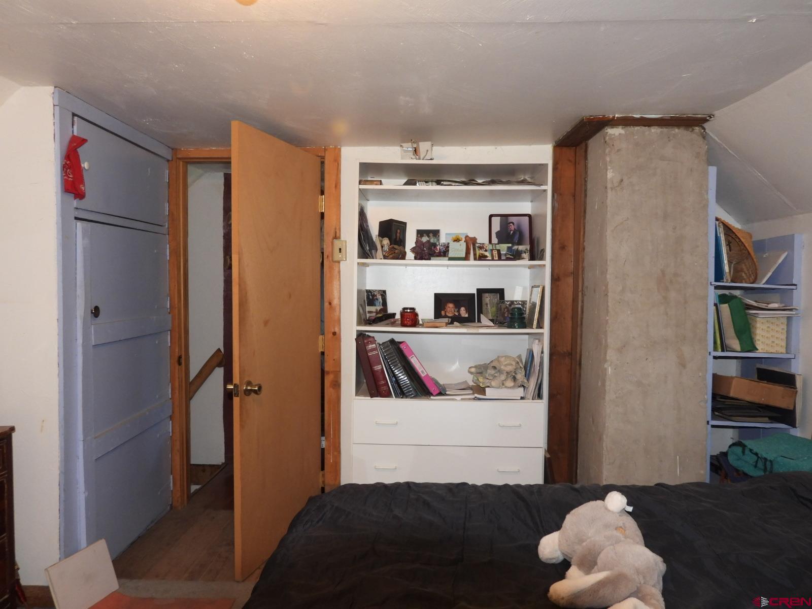 21764 R Road Cedaredge, CO 81413 - Photo 7 of 27 a bedroom with a bed and closet