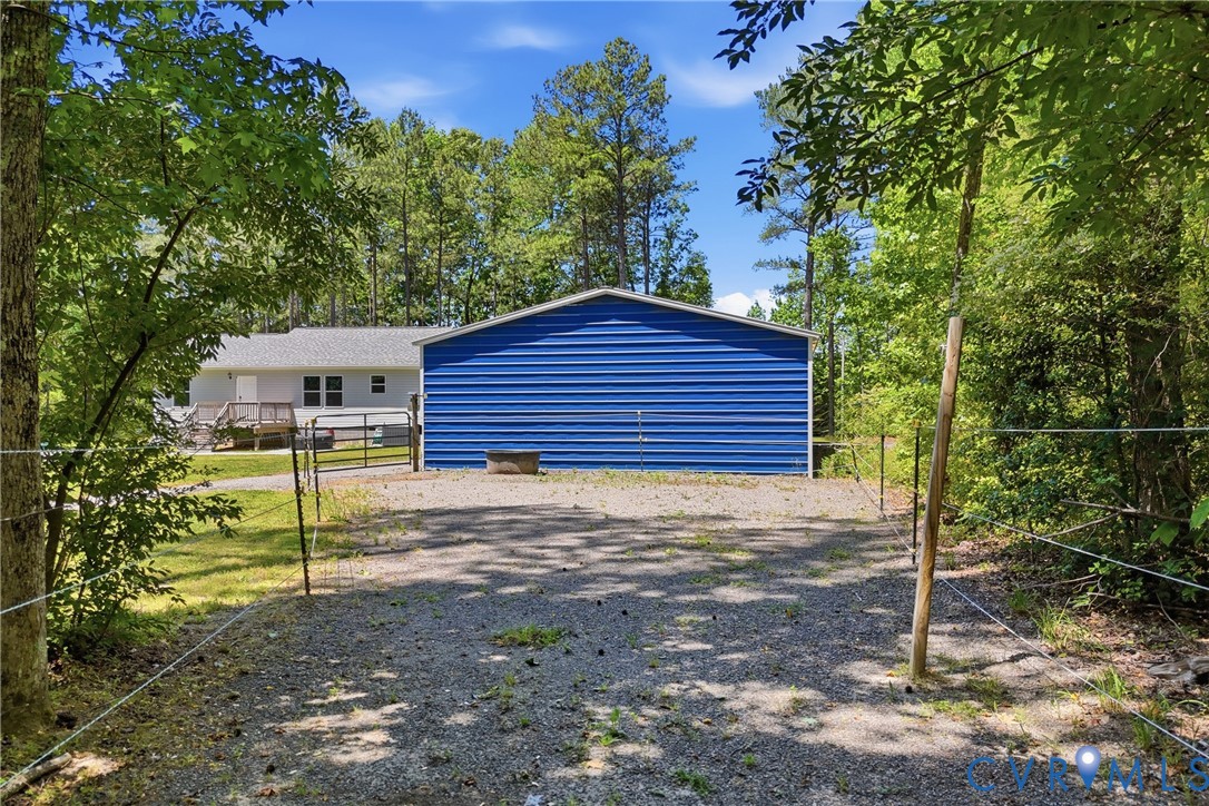 93 Faraway Road Saluda, VA 23149 - Photo 49 of 58 a view of a house with a yard