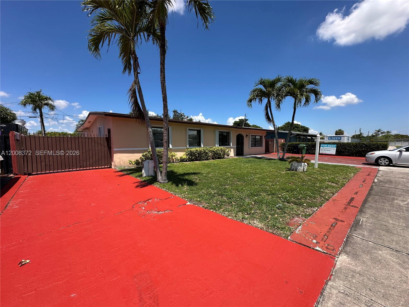3100 Southwest 103rd Court Miami, FL 33165 - Photo 2 of 8 a front view of a house with garden
