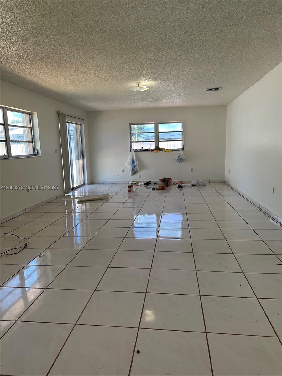 3100 Southwest 103rd Court Miami, FL 33165 - Photo 6 of 8 a room with gym equipment and view of living room