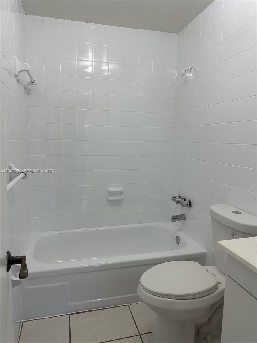 3100 Southwest 103rd Court Miami, FL 33165 - Photo 7 of 8 a bathroom with a toilet and a bathtub