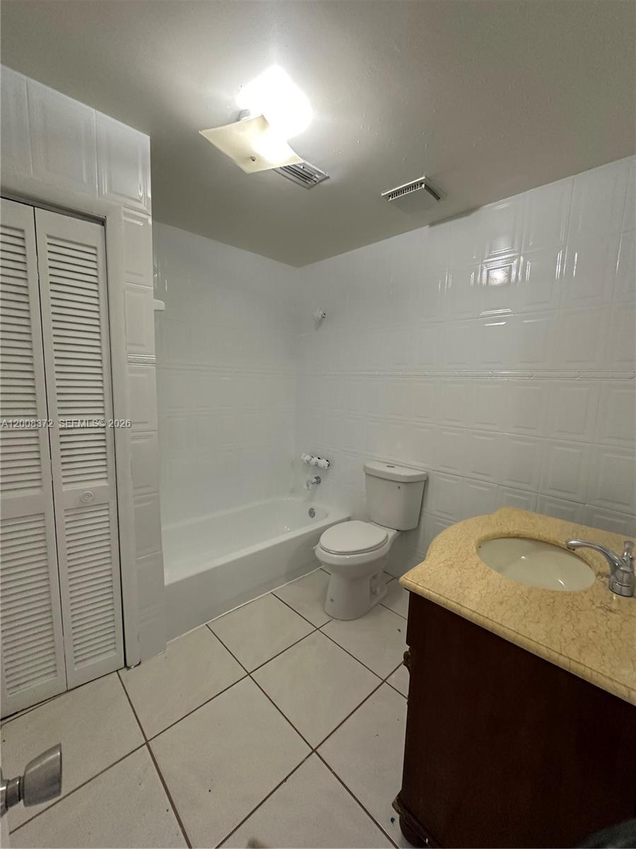 3100 Southwest 103rd Court Miami, FL 33165 - Photo 8 of 8 a bathroom with a sink a toilet and shower