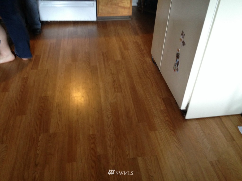 1071 Woodcock Road Sequim, WA 98382 - Photo 3 of 10 a view of a hallway with wooden floor