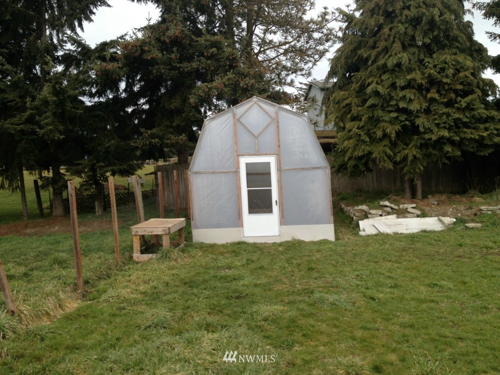 1071 Woodcock Road Sequim, WA 98382 - Photo 9 of 10 a view of a house with a backyard
