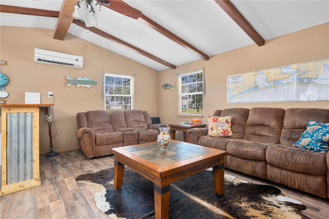 108 Palmetto Point Road Rockport, TX 78382 - Photo 13 of 22 a living room with furniture and a table