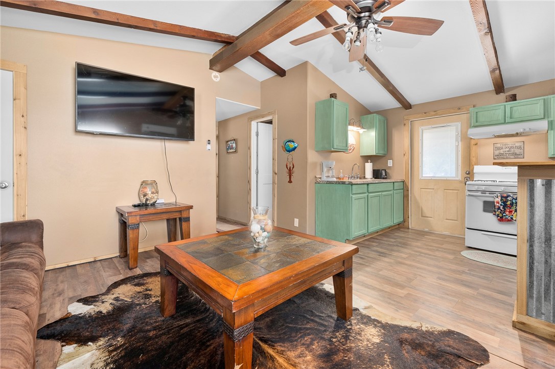 108 Palmetto Point Road Rockport, TX 78382 - Photo 15 of 22 a living room with furniture and a flat screen tv