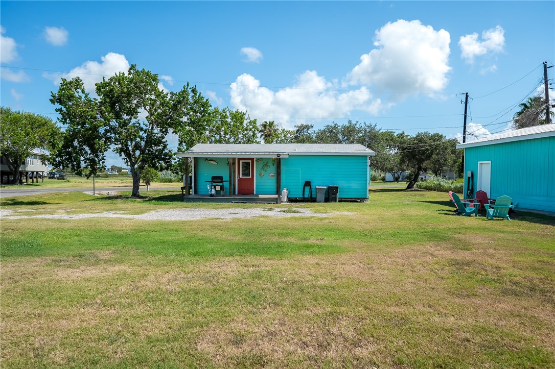 108 Palmetto Point Road Rockport, TX 78382 - Photo 3 of 22 a view of house with a big yard