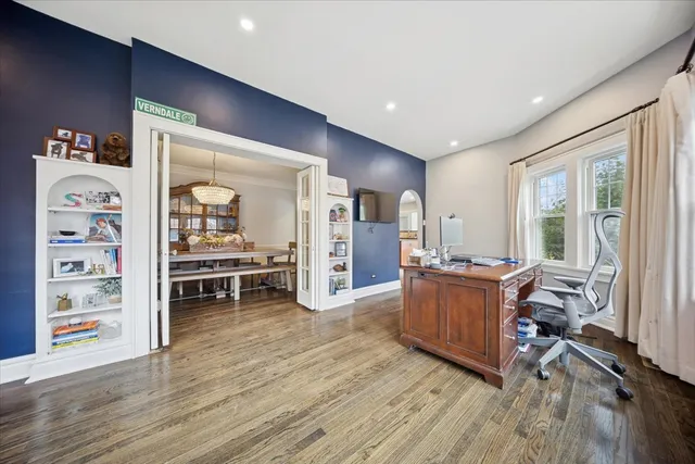 a living room with furniture and wooden floors