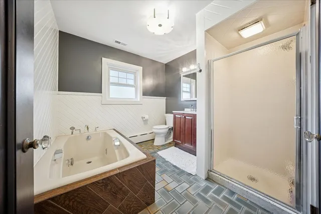 a bathroom with a bathtub and a shower