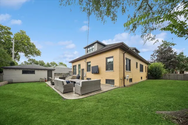 a view of a patio with a table and chairs