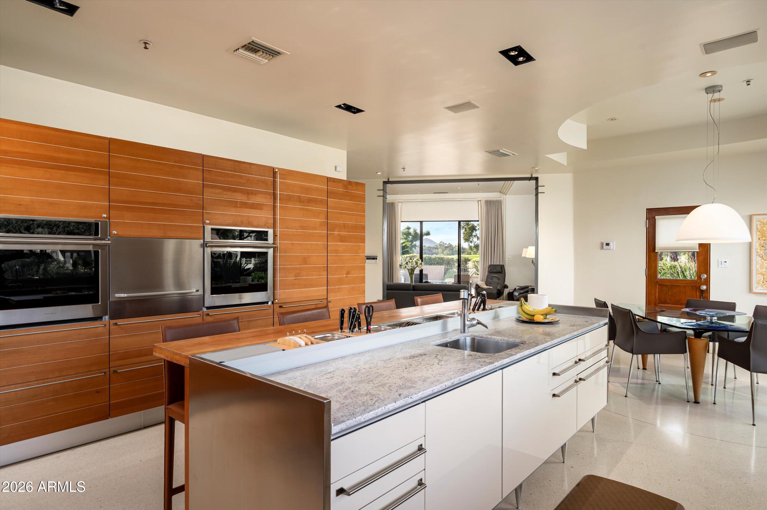 7878 East Gainey Ranch Road, Unit 65 Scottsdale, AZ 85258 - Photo 21 of 73 Kitchen to Family Room