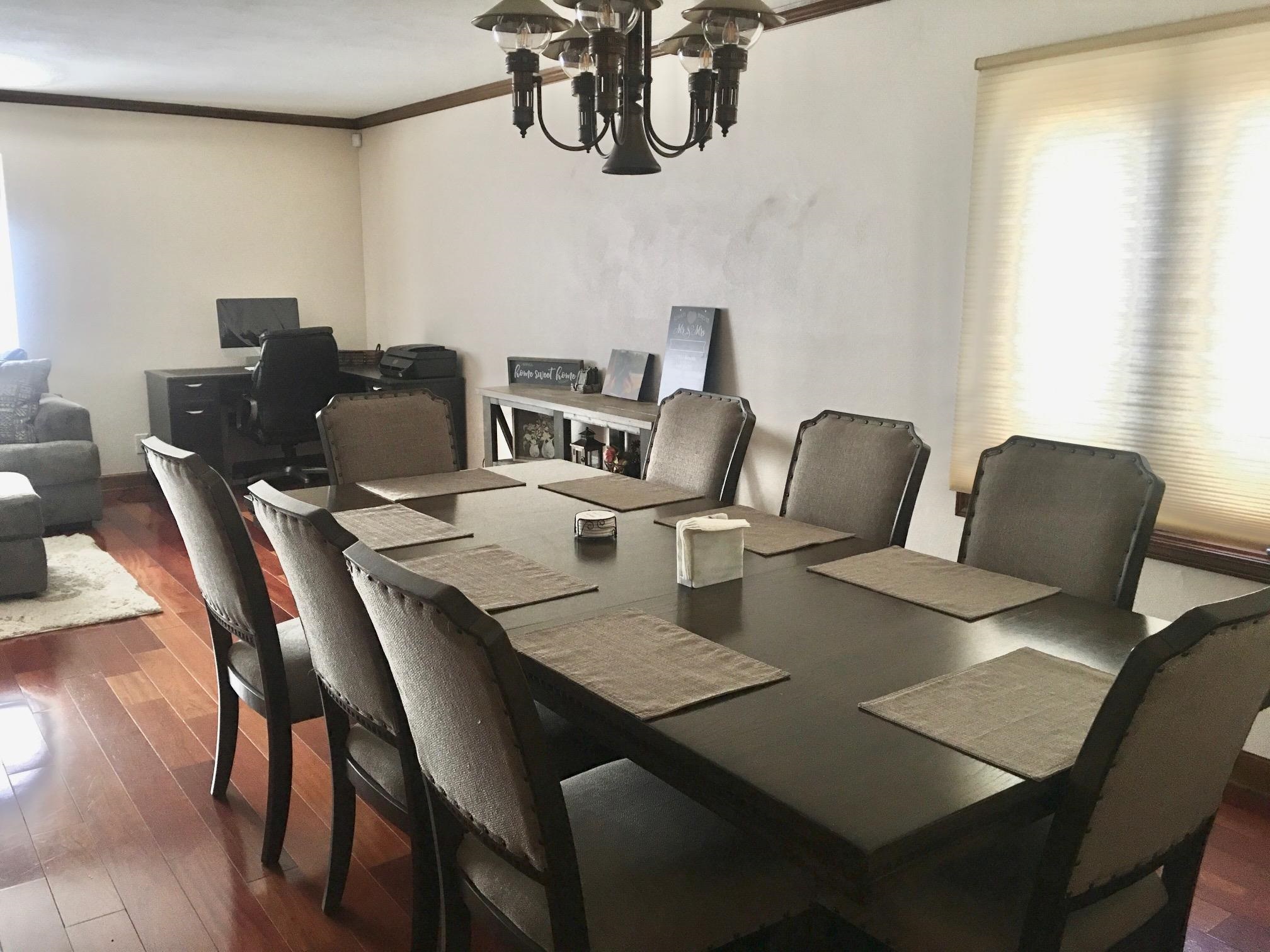 256 Spring Creek Road Rockford, IL 61114 - Photo 12 of 29 a view of a dining room with furniture and chandelier