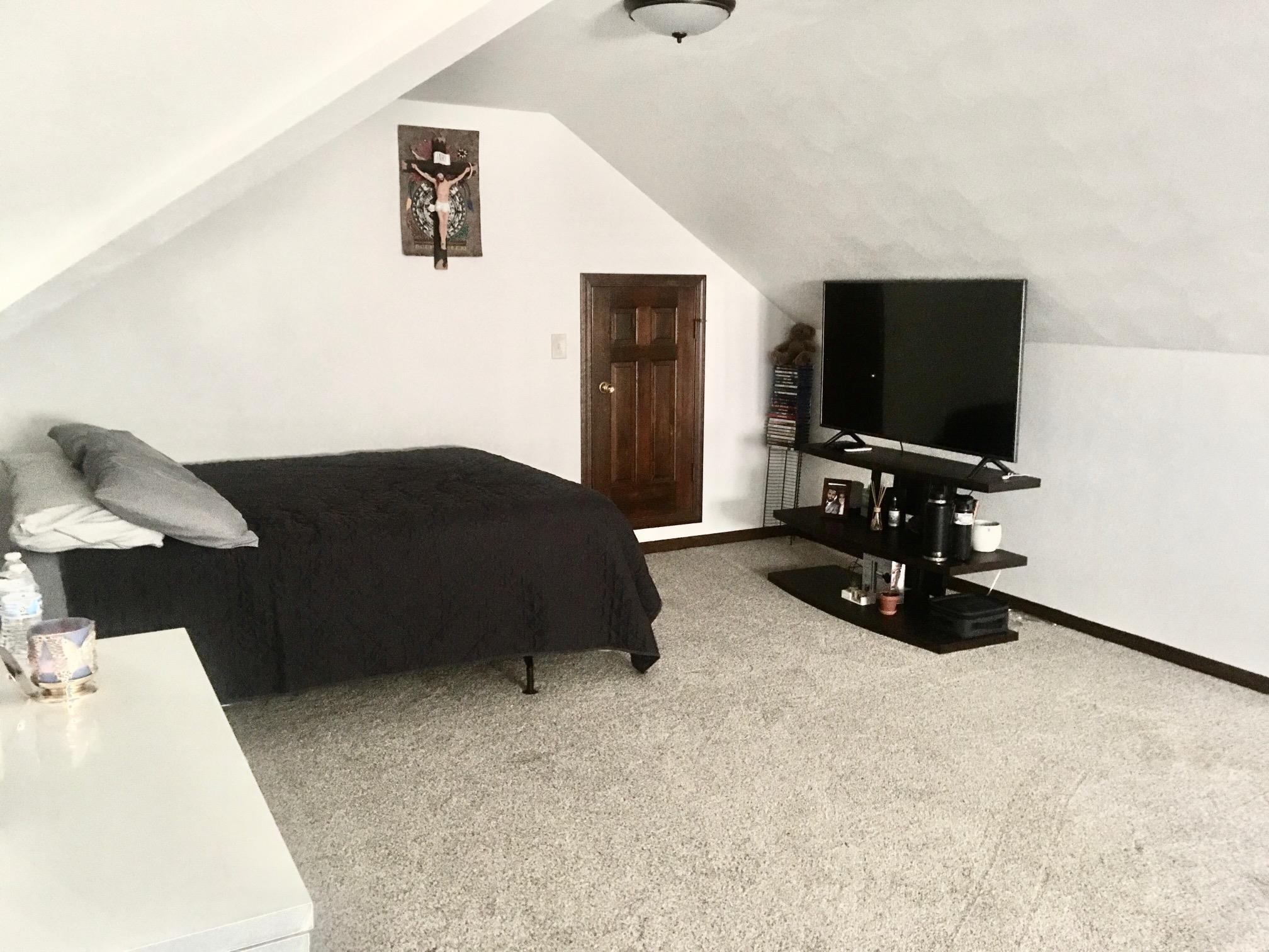 256 Spring Creek Road Rockford, IL 61114 - Photo 19 of 29 a bedroom with a bed and a flat screen tv
