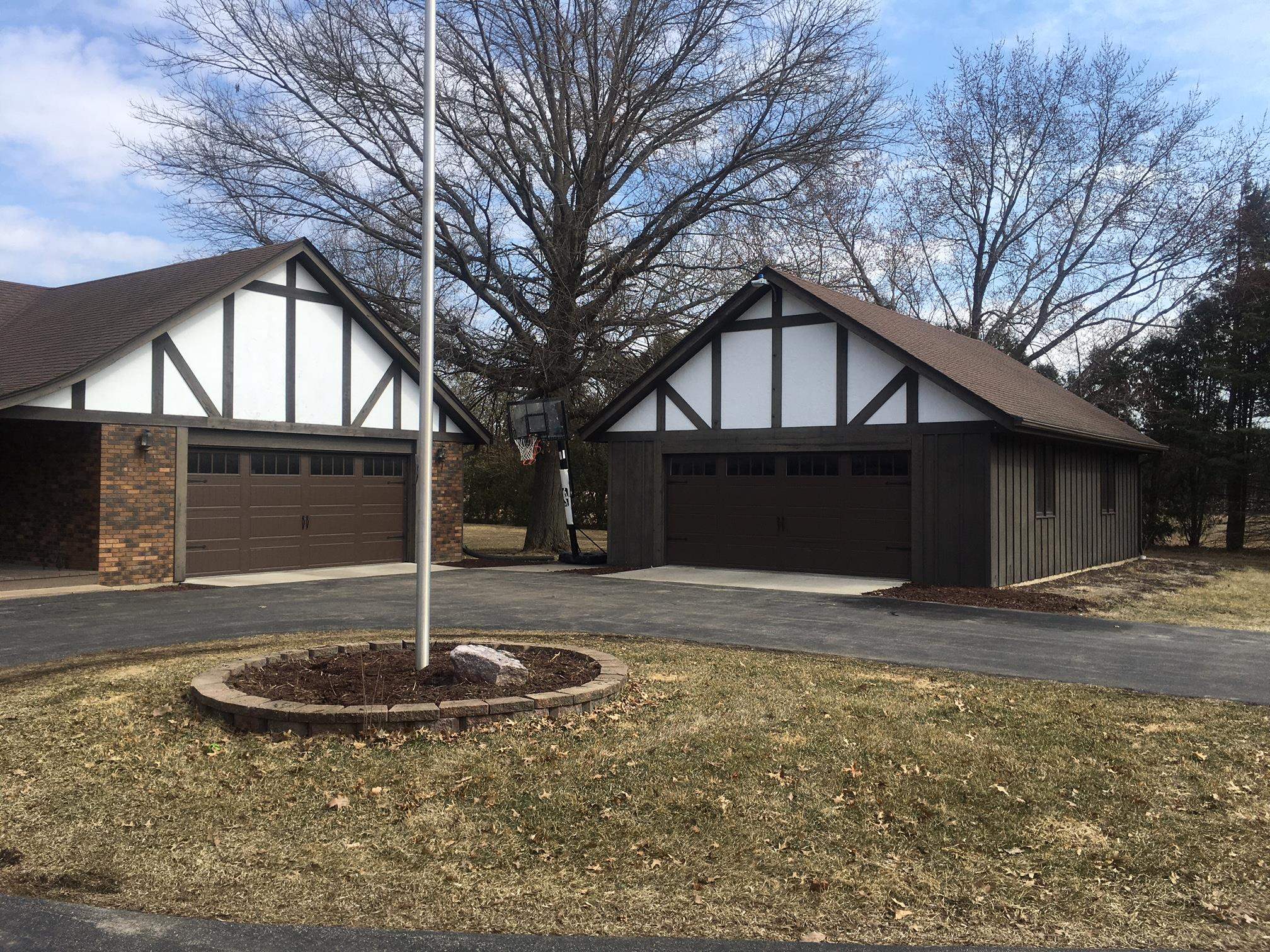 256 Spring Creek Road Rockford, IL 61114 - Photo 23 of 29 a front view of a house with garden