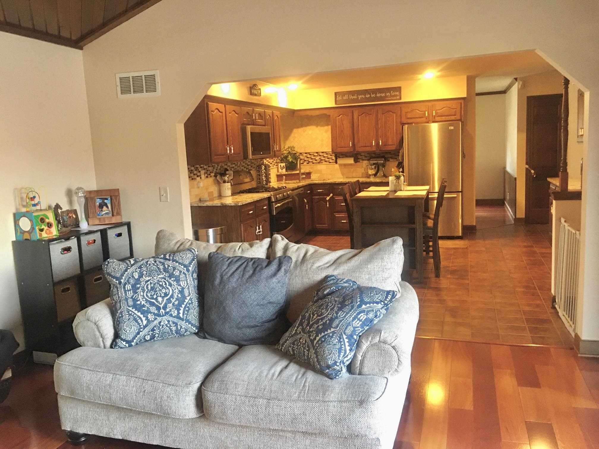 256 Spring Creek Road Rockford, IL 61114 - Photo 8 of 29 a living room with furniture and a view of kitchen
