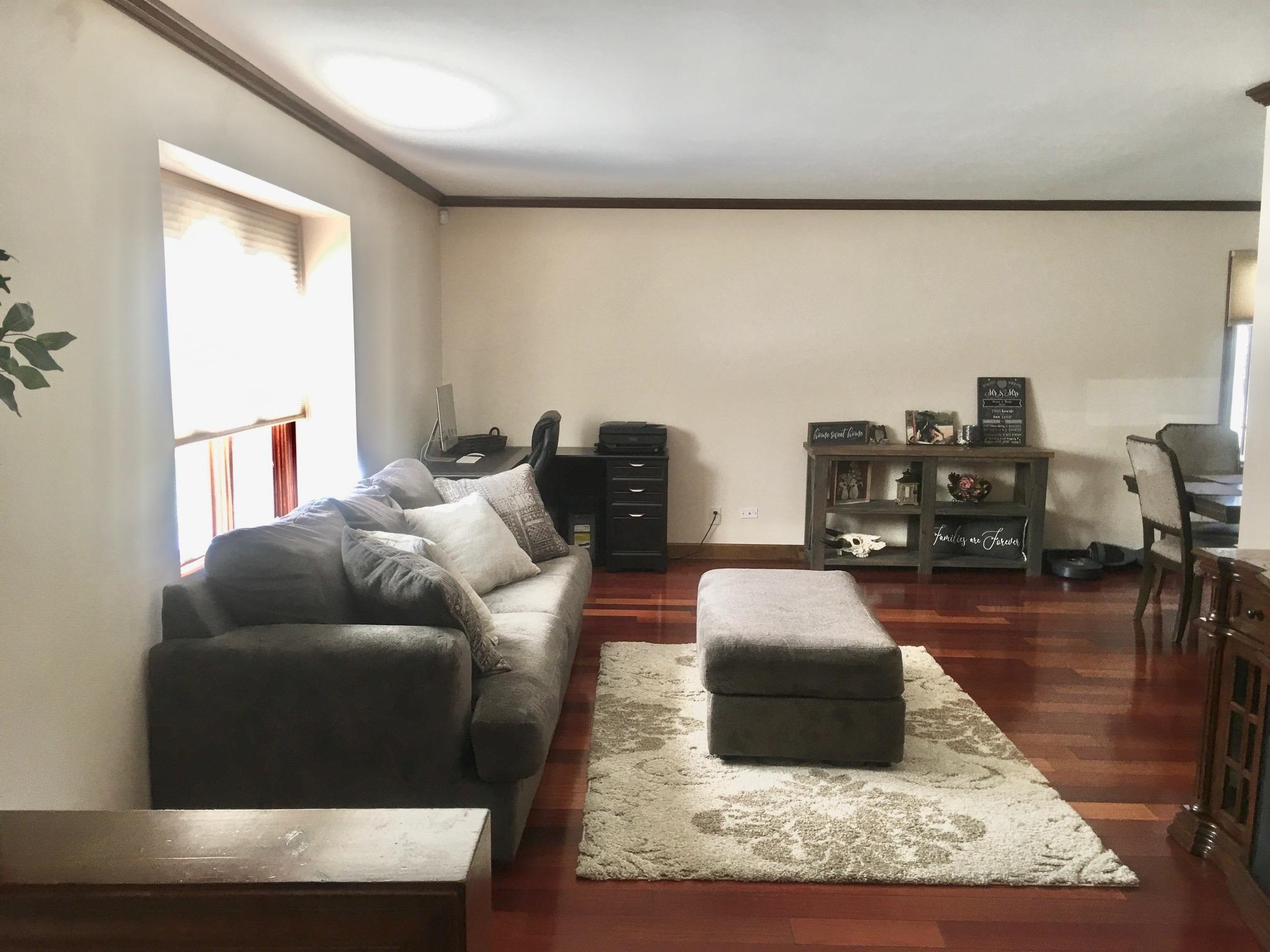 256 Spring Creek Road Rockford, IL 61114 - Photo 9 of 29 a living room with furniture and a wooden floor