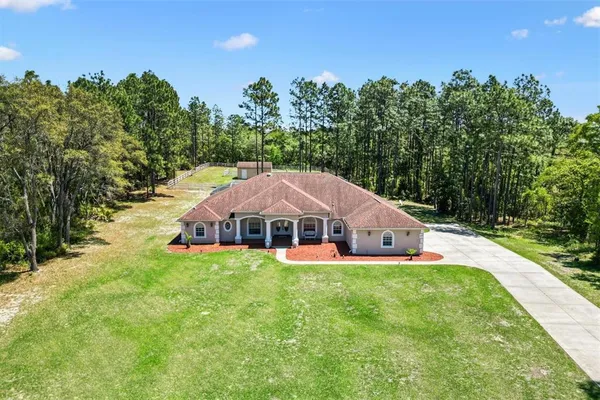a view of a house with a big yard