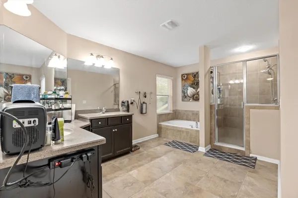 a room with a table chairs and a view of kitchen