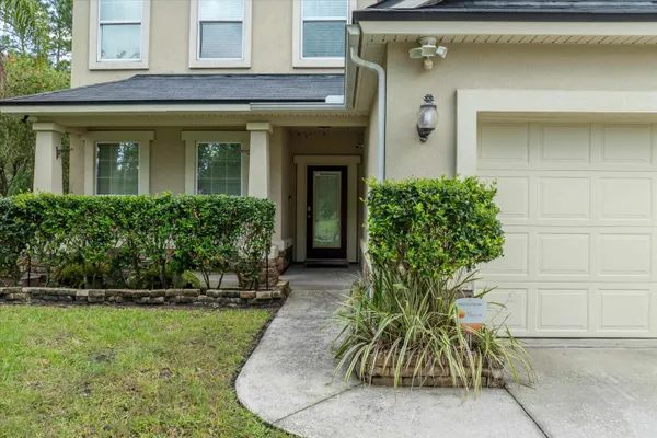 a kitchen with a refrigerator a sink and cabinets