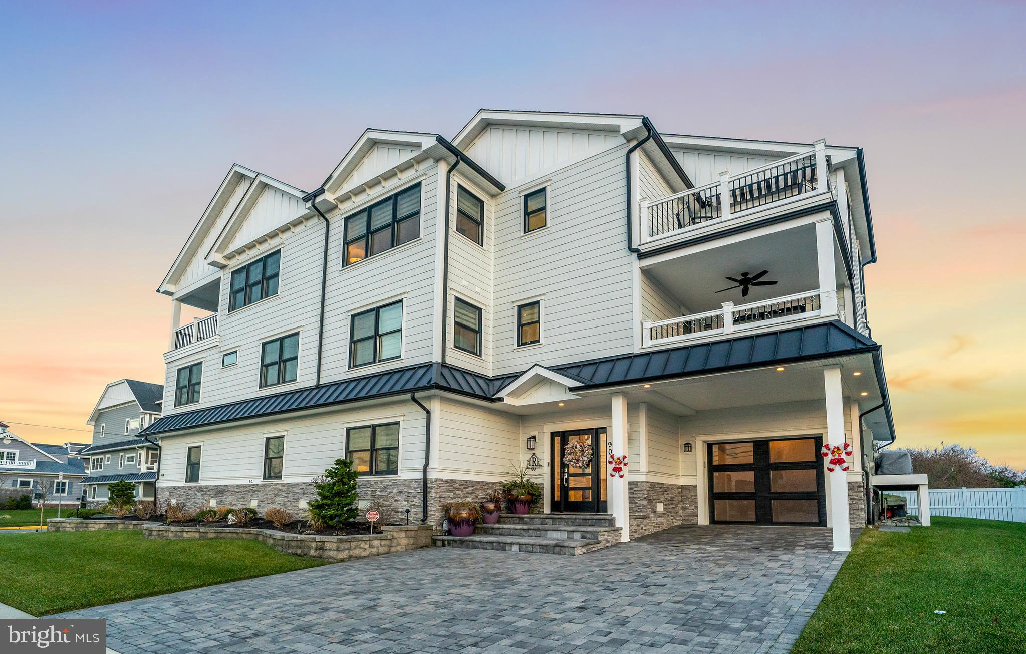 901 South Commonwealth Avenue, Unit SOUTH Strathmere, NJ 08248 - Photo 1 of 66 a front view of a house with garden