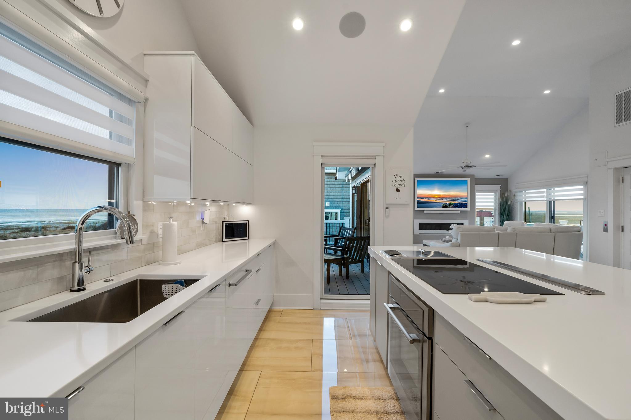 901 South Commonwealth Avenue, Unit SOUTH Strathmere, NJ 08248 - Photo 11 of 66 a kitchen with stainless steel appliances a sink stove and cabinets