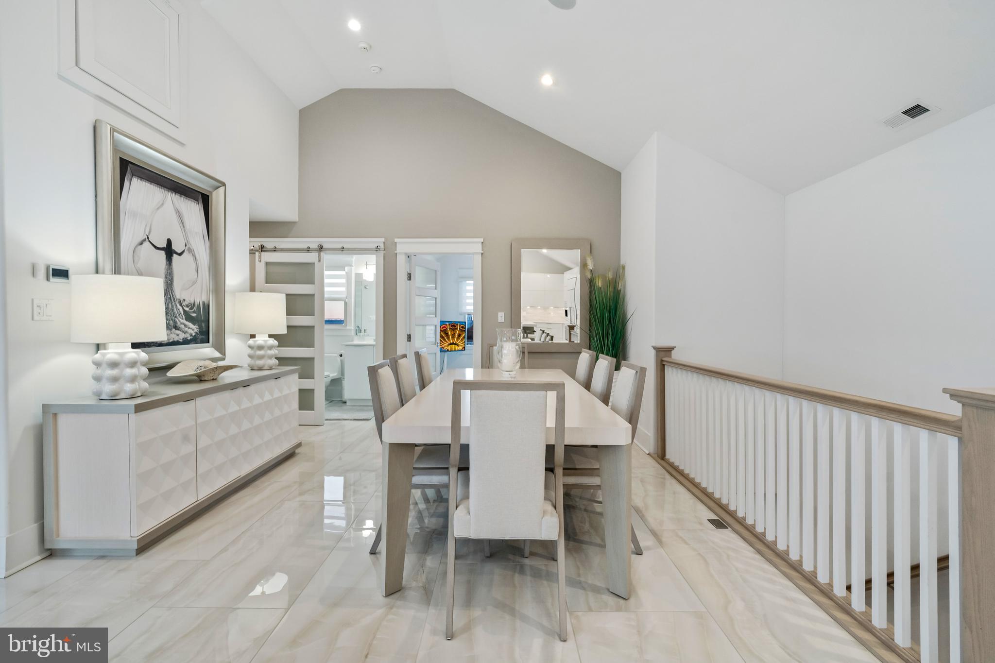 901 South Commonwealth Avenue, Unit SOUTH Strathmere, NJ 08248 - Photo 14 of 66 a large kitchen with a table and chairs