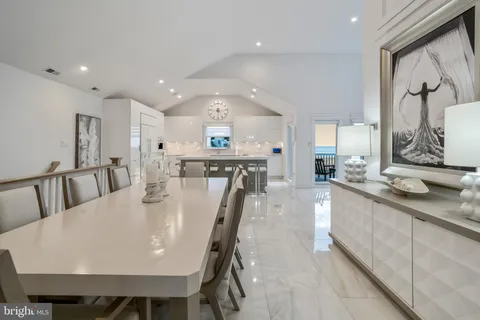 a view of a chairs and table in patio