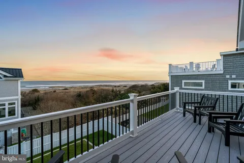 a bedroom with a bed and glass door