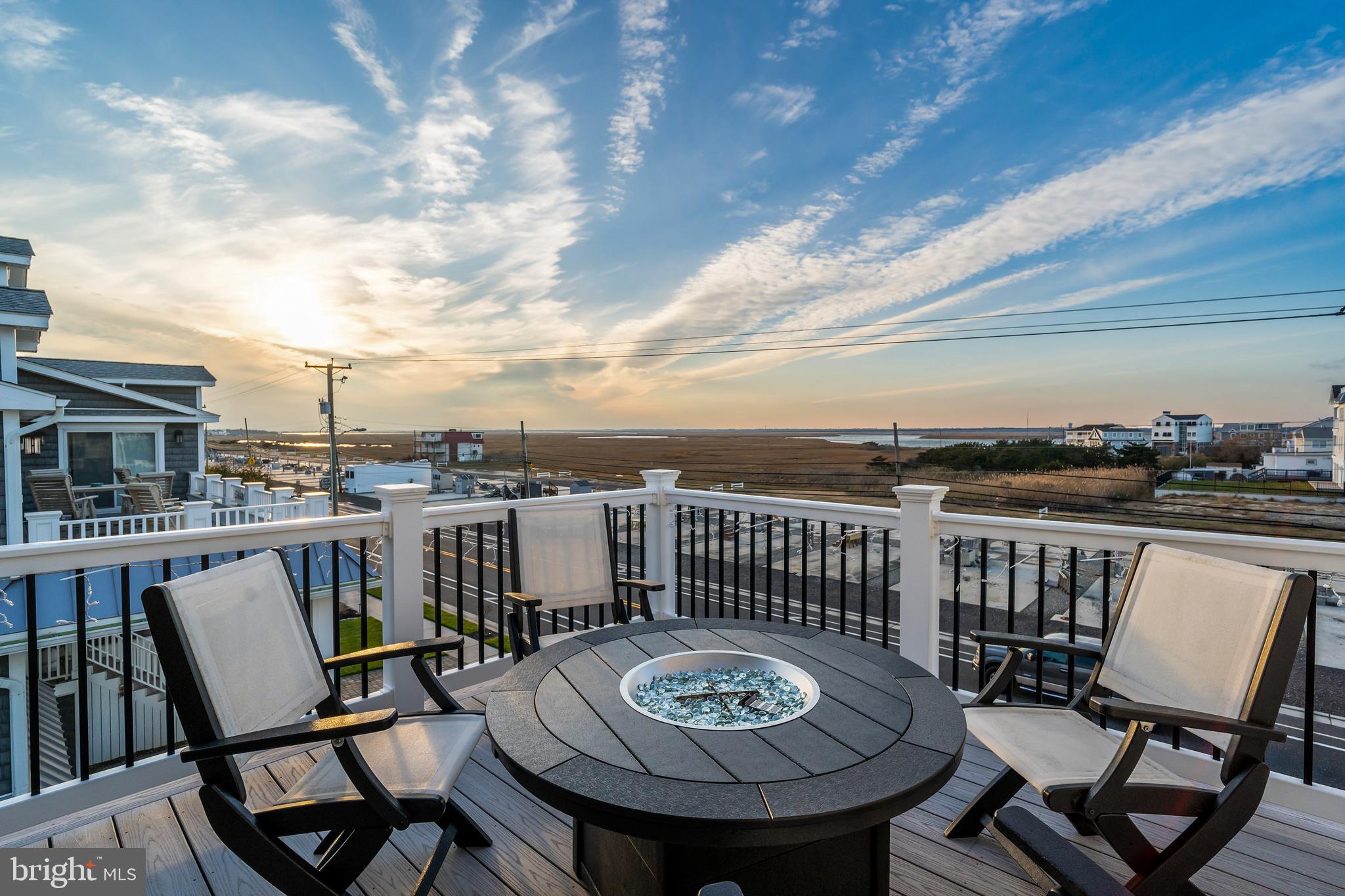 901 South Commonwealth Avenue, Unit SOUTH Strathmere, NJ 08248 - Photo 20 of 66 a view of a chairs and table in patio