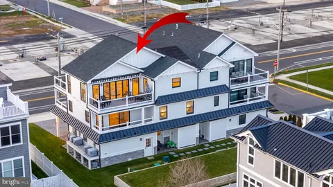 a front view of a residential apartment building with a yard