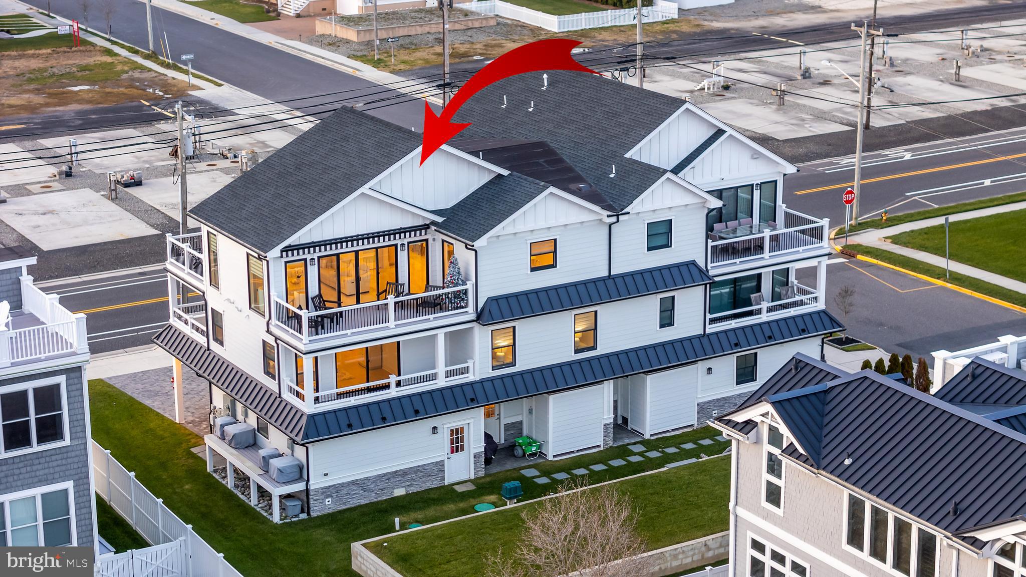 901 South Commonwealth Avenue, Unit SOUTH Strathmere, NJ 08248 - Photo 2 of 66 a front view of a residential apartment building with a yard