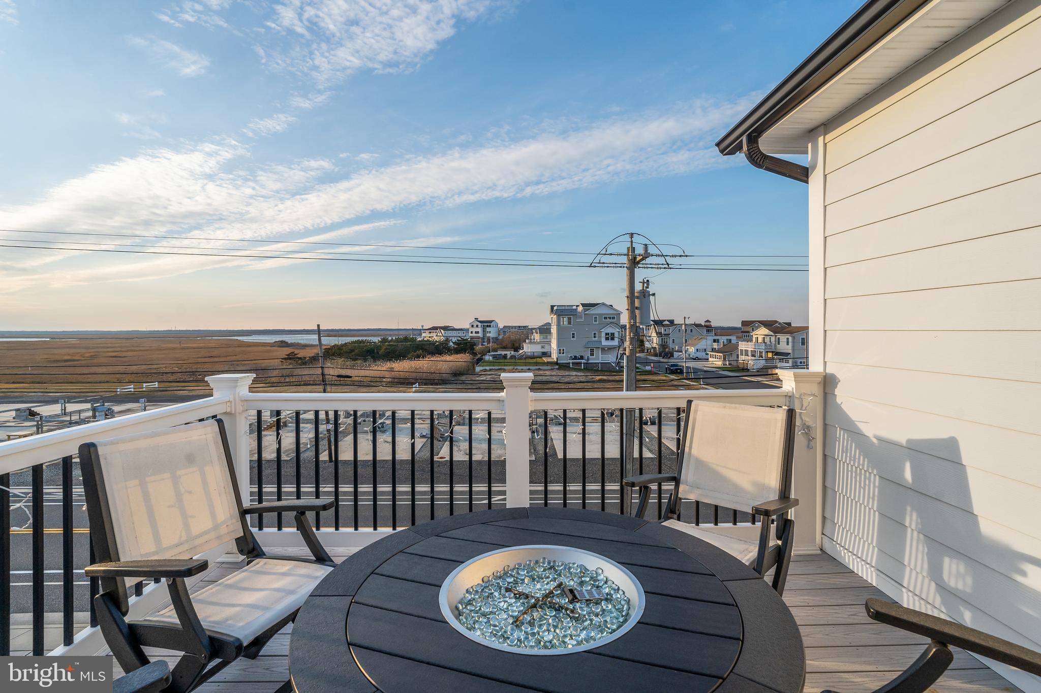 901 South Commonwealth Avenue, Unit SOUTH Strathmere, NJ 08248 - Photo 21 of 66 a view of a balcony with furniture