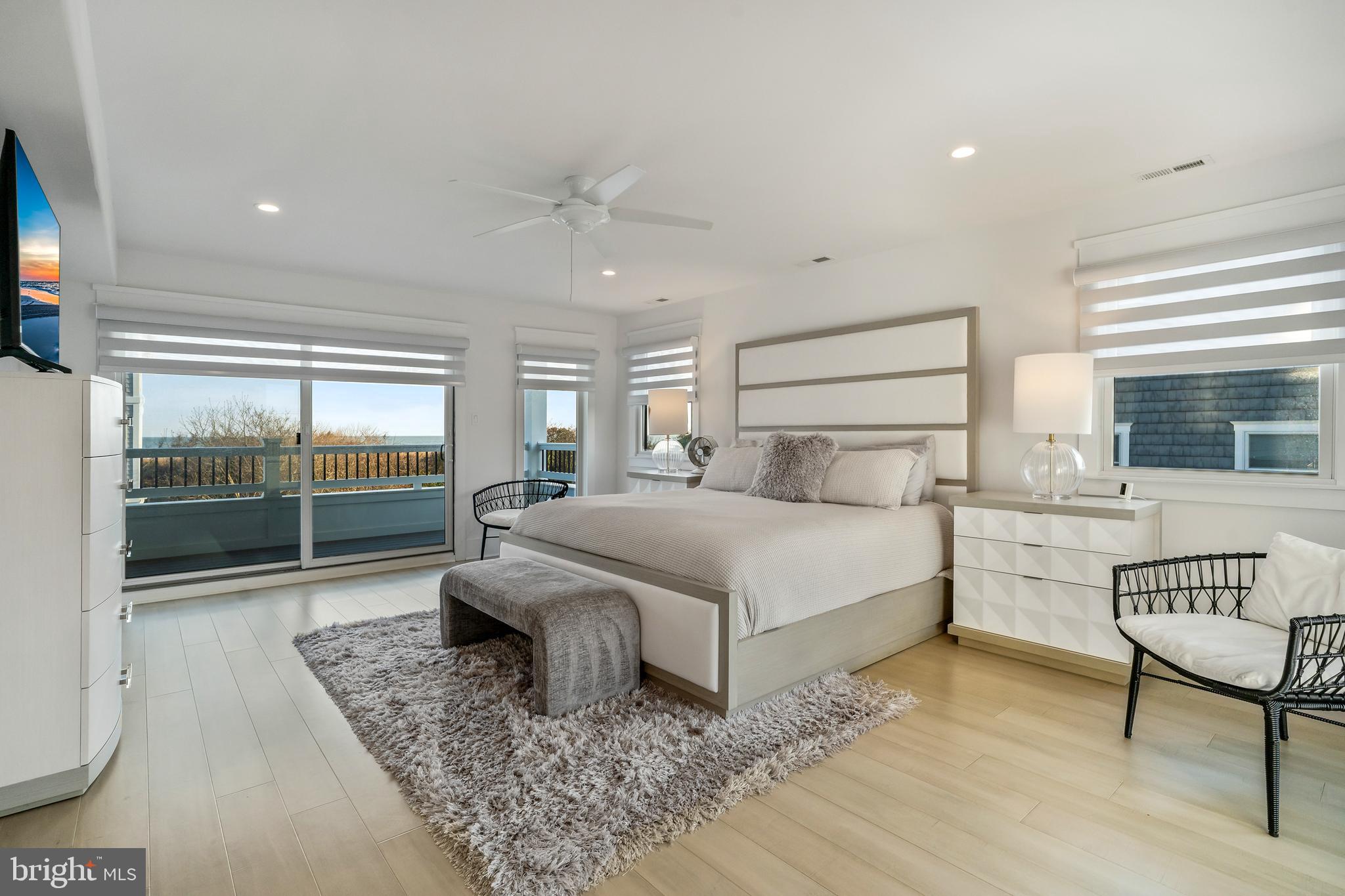 901 South Commonwealth Avenue, Unit SOUTH Strathmere, NJ 08248 - Photo 22 of 66 a bedroom with a bed and glass door