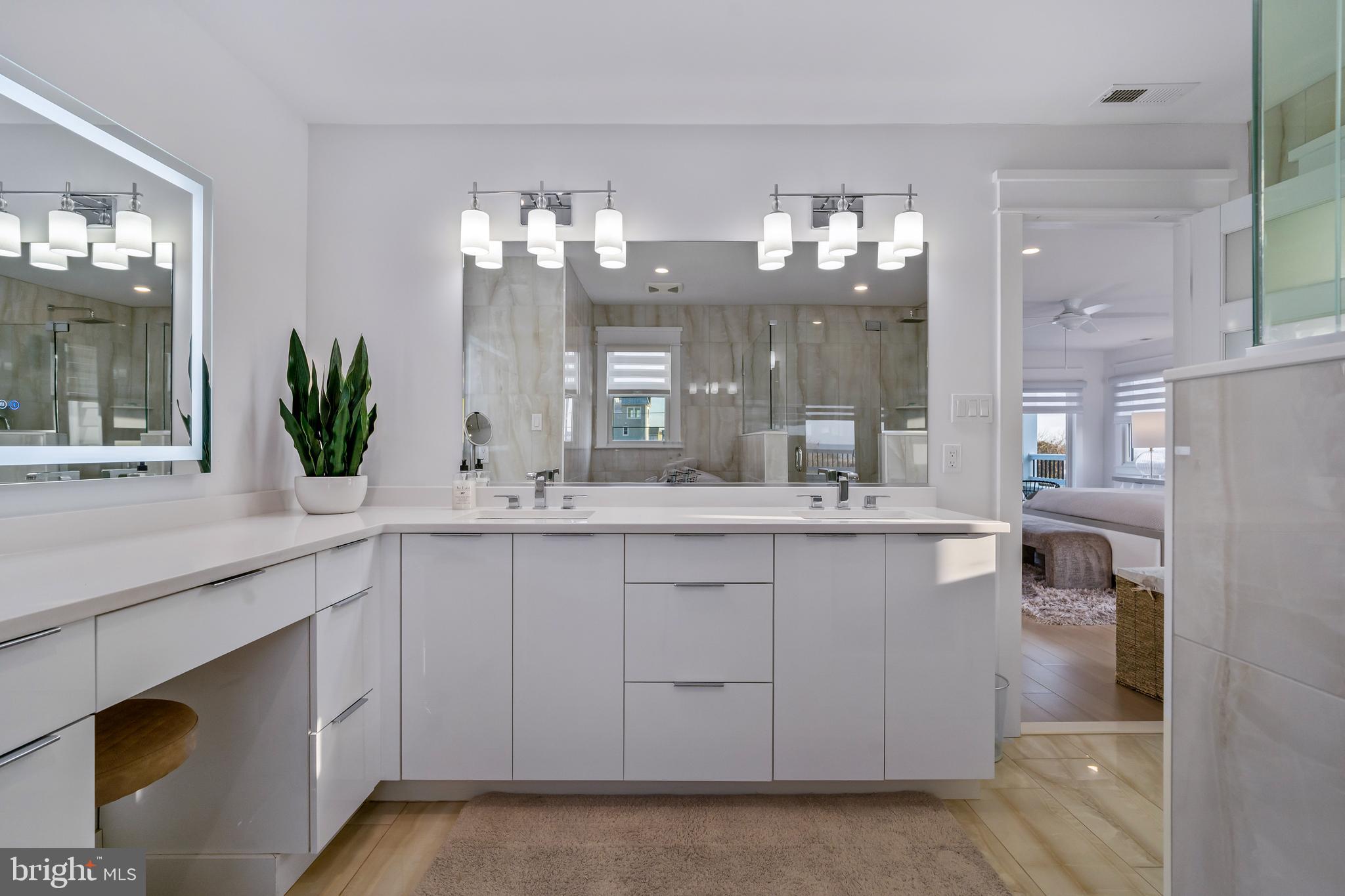 901 South Commonwealth Avenue, Unit SOUTH Strathmere, NJ 08248 - Photo 34 of 66 a bathroom with a sink and a mirror
