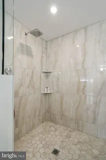 a bathroom with a shower toilet and sink