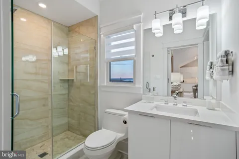 a view of a hallway with furniture and window