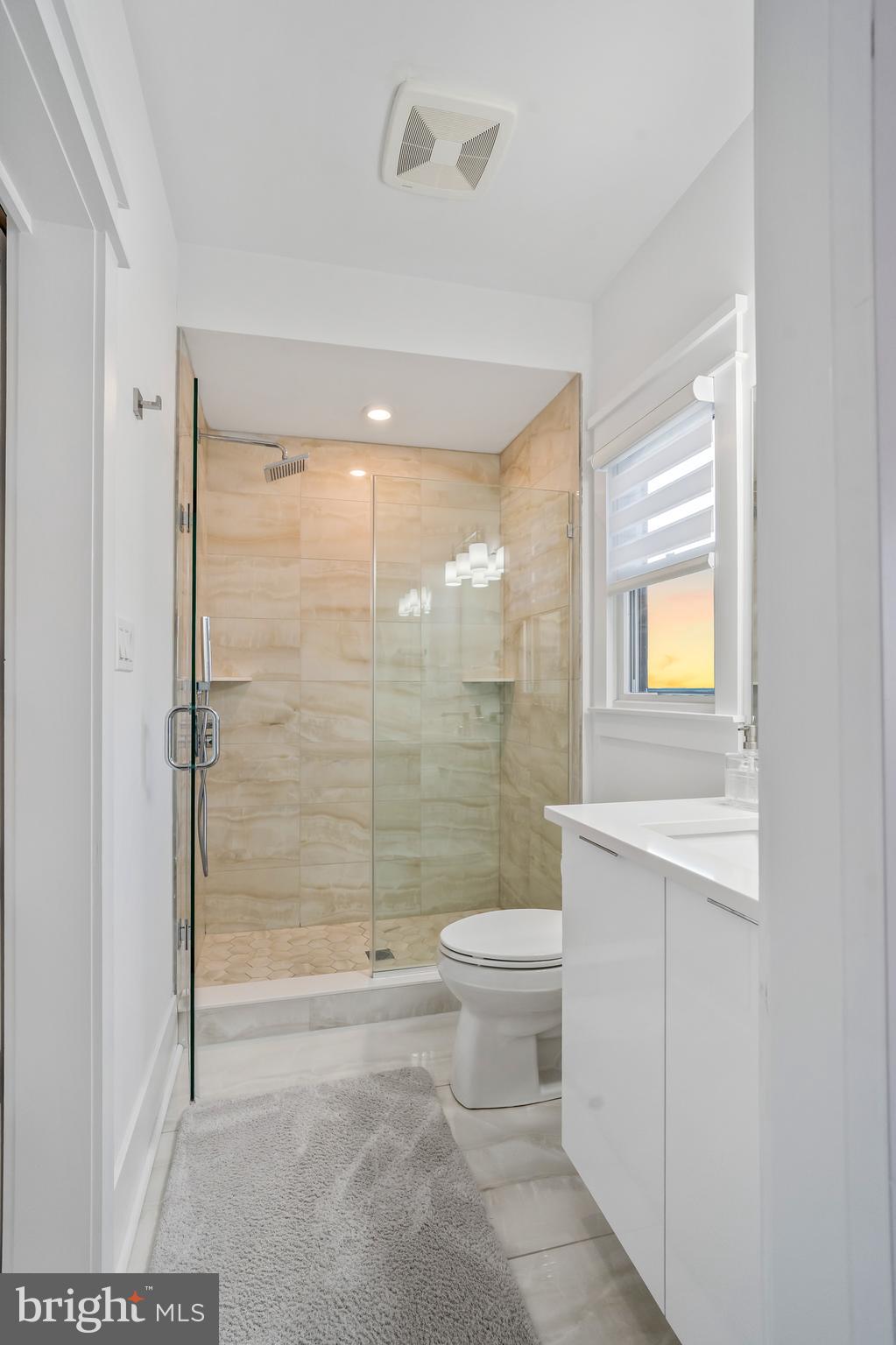 901 South Commonwealth Avenue, Unit SOUTH Strathmere, NJ 08248 - Photo 43 of 66 a bathroom with a shower toilet and sink