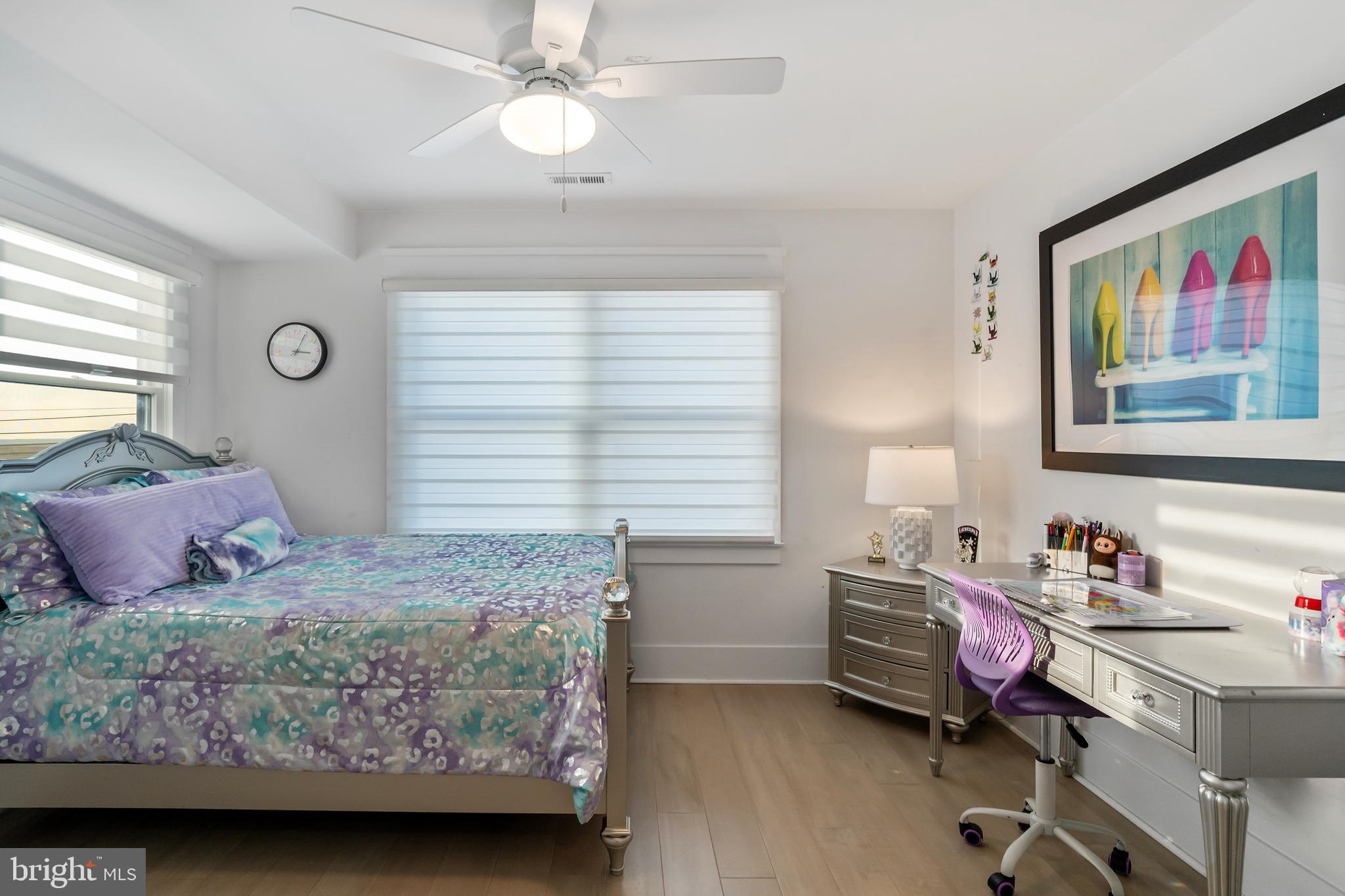 901 South Commonwealth Avenue, Unit SOUTH Strathmere, NJ 08248 - Photo 44 of 66 a bedroom with a bed and a window