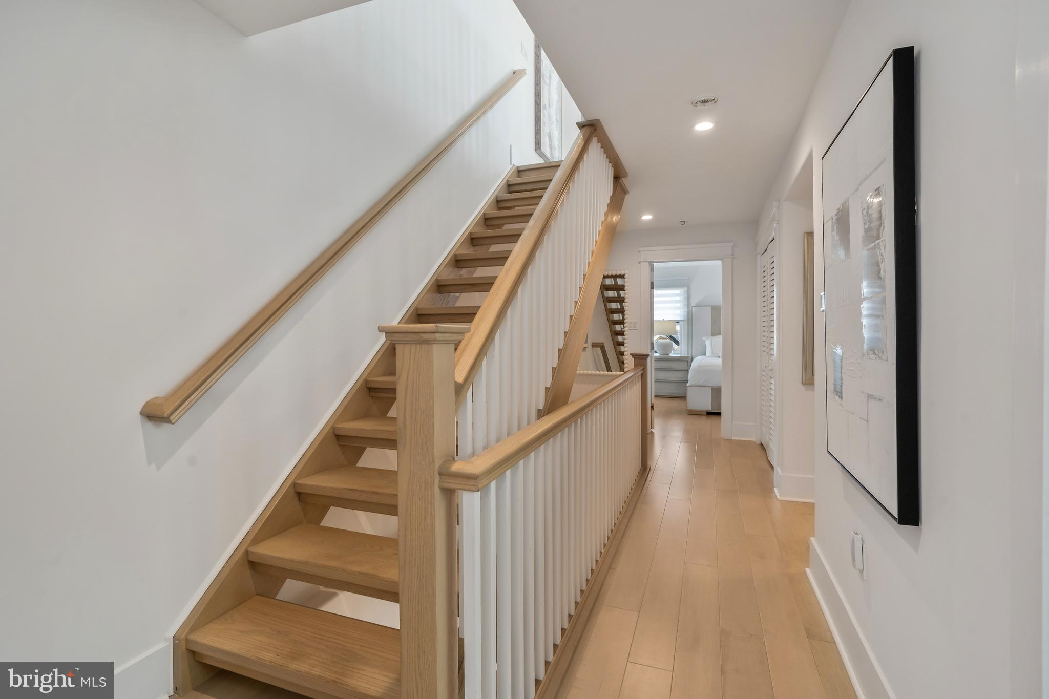 901 South Commonwealth Avenue, Unit SOUTH Strathmere, NJ 08248 - Photo 47 of 66 a view of a hallway with wooden floor and staircase