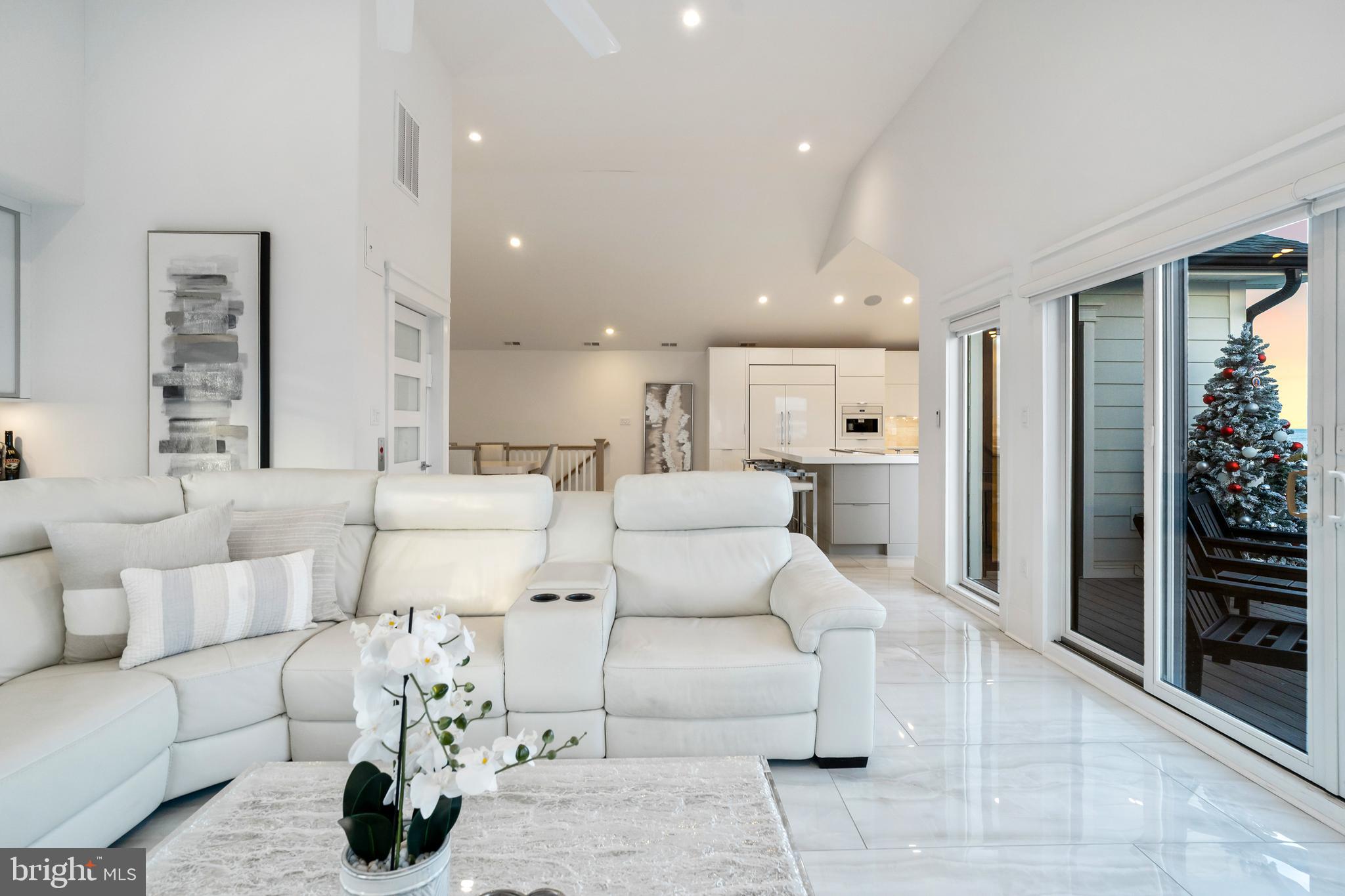 901 South Commonwealth Avenue, Unit SOUTH Strathmere, NJ 08248 - Photo 8 of 66 a living room with furniture and a large window
