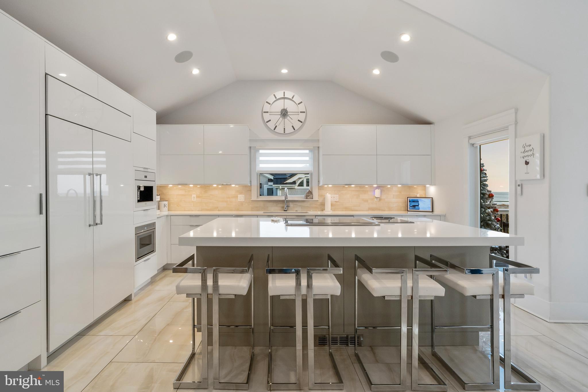 901 South Commonwealth Avenue, Unit SOUTH Strathmere, NJ 08248 - Photo 9 of 66 a kitchen with a table and chairs in it