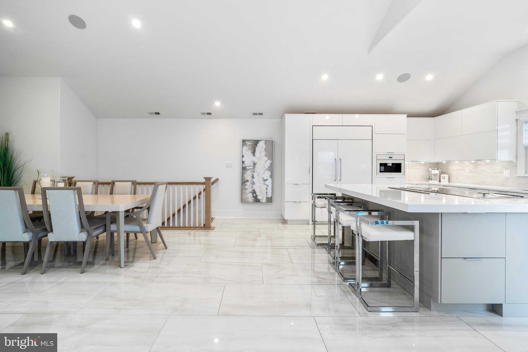 901 South Commonwealth Avenue, Unit SOUTH Strathmere, NJ 08248 - Photo 10 of 66 a large kitchen with a table and chairs