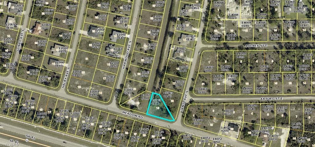 3057 Meadow Road Lehigh Acres, FL 33974 - Photo 2 of 2 Aerial map of property and surrounding area with property parcel outlined