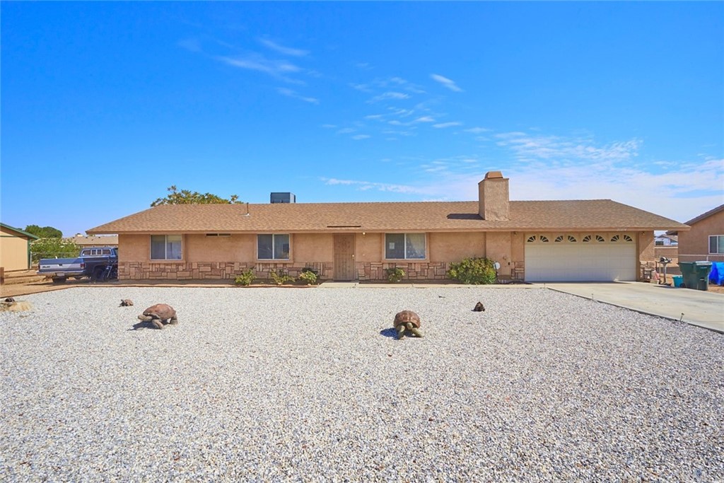 21054 Rambling Road Apple Valley, CA 92308 - Photo 1 of 1 a view of a house with a yard
