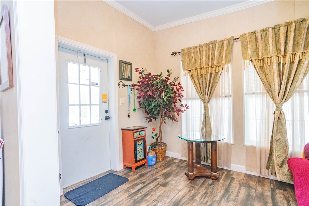 301 Valencia Street Sebastian, FL 32958 - Photo 11 of 29 a view of a room with wooden floor and door