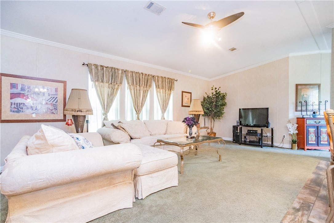 301 Valencia Street Sebastian, FL 32958 - Photo 13 of 29 a living room with furniture and a flat screen tv