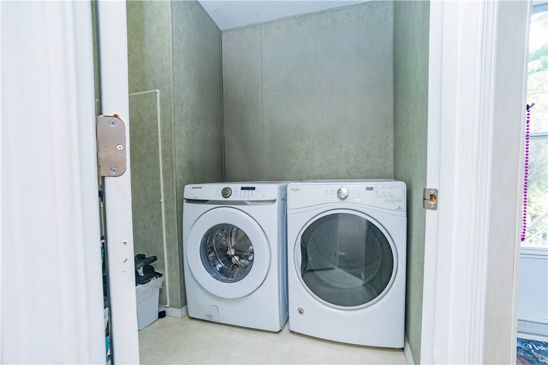 301 Valencia Street Sebastian, FL 32958 - Photo 16 of 29 a utility room with dryer and washer