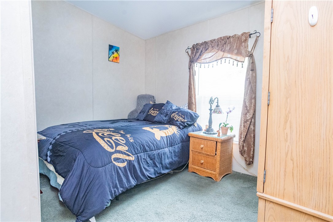 301 Valencia Street Sebastian, FL 32958 - Photo 18 of 29 a bedroom with a bed and a window